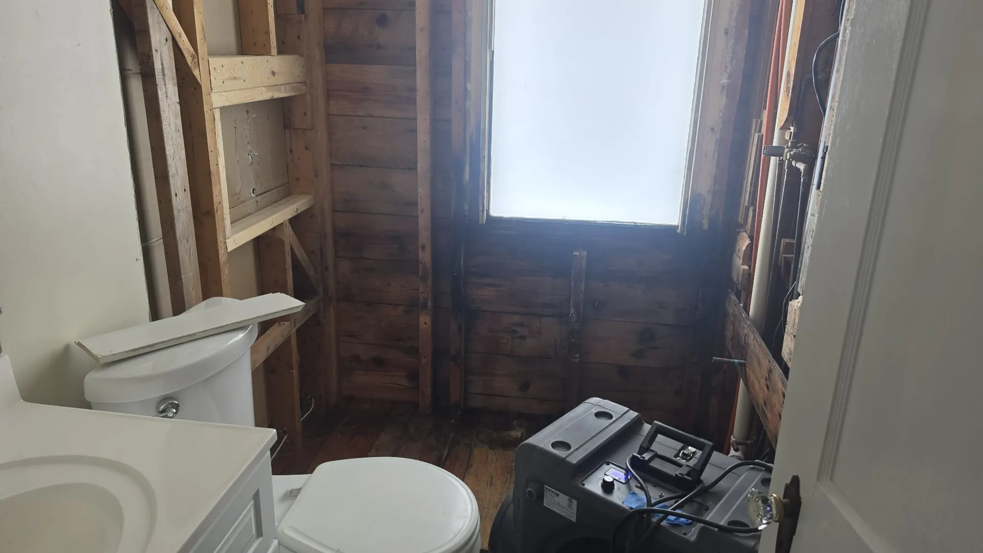 Mold growth on a bathroom ceiling and wall corner