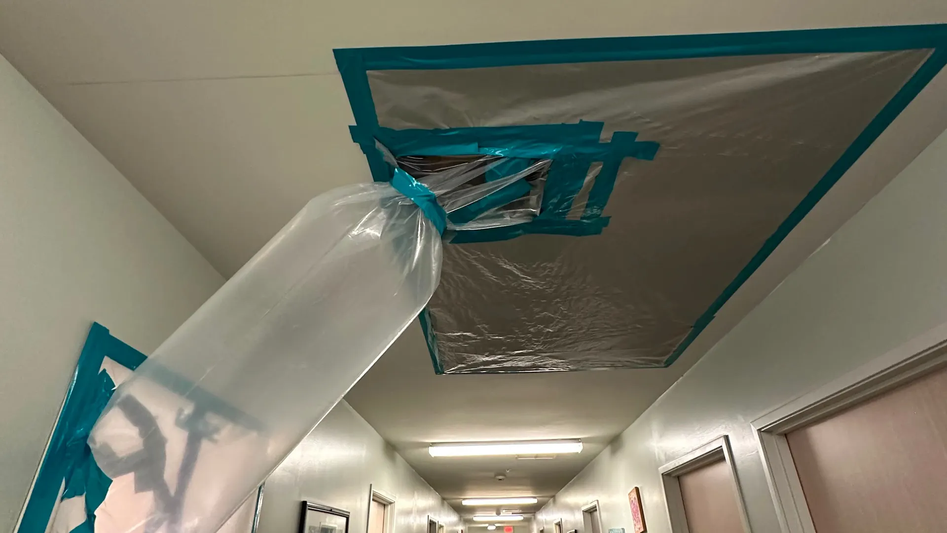 Sealed containment hallway during a commercial mold remediation project