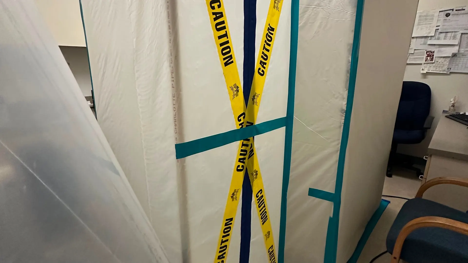 Containment barrier set up in an office during mold remediation