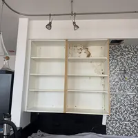 Bedroom with built-in shelving being prepared for mold remediation before a home sale