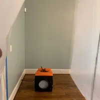 HEPA air scrubber cleaning the air inside a sealed room