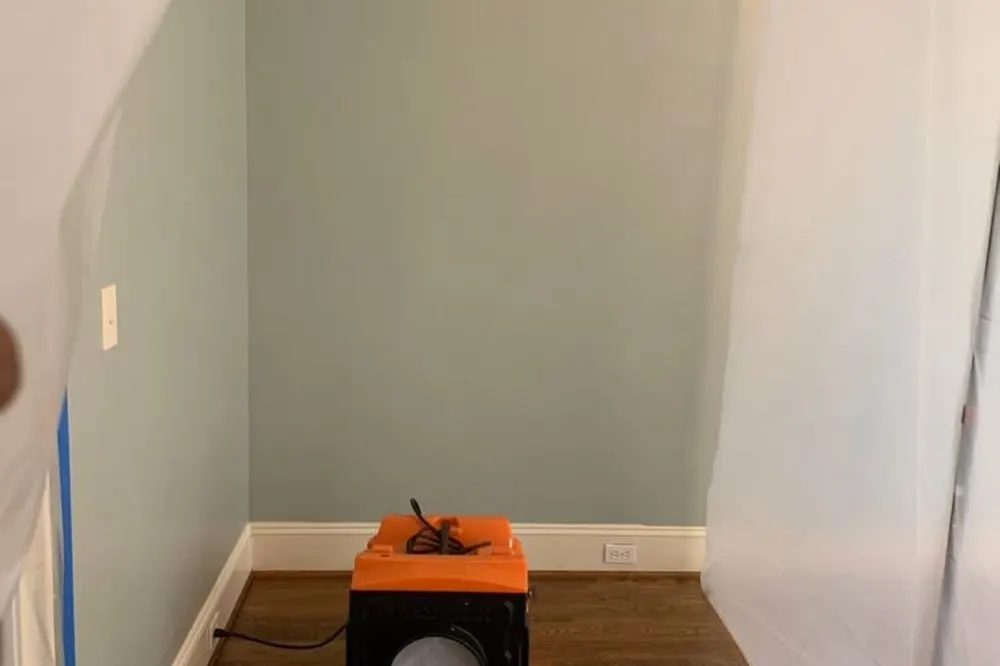 HEPA air scrubber cleaning the air inside a sealed room