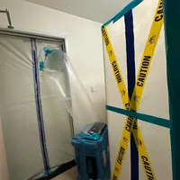 Sealed mold containment with zipper door and HEPA air scrubber