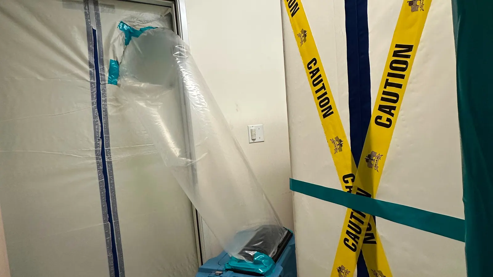 HEPA air scrubber running inside a sealed room during contents mold cleaning